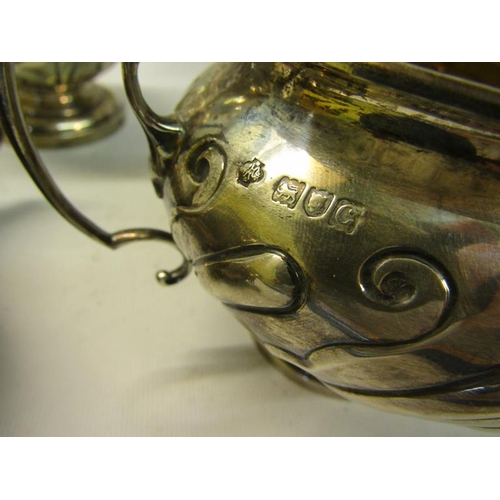 308 - A four piece silver tea and coffee service of baluster form.  The coffee and tea pot with hinged, sl... 