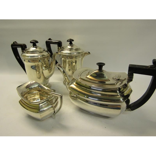 310 - A silver four piece tea and coffee service comprising tea and coffee pot together with water jug and... 