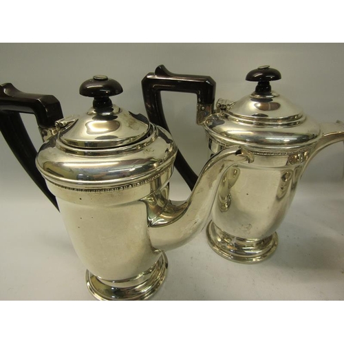 310 - A silver four piece tea and coffee service comprising tea and coffee pot together with water jug and... 