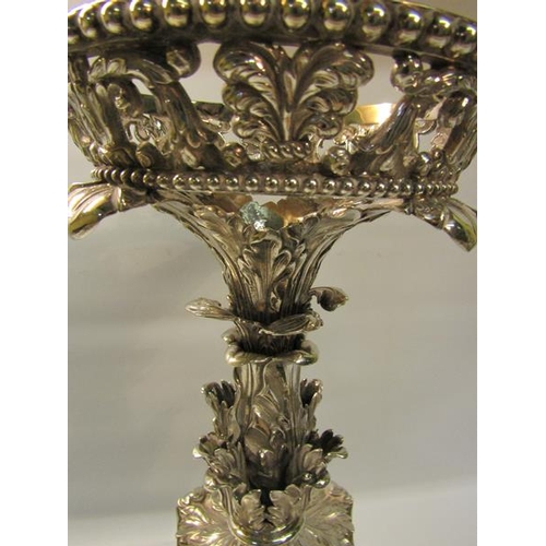 315 - A George III silver table centrepiece, the upper circular beaded and scrolling leaf pierced basket s... 