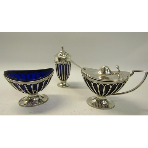 252 - An Edwardian silver three piece condiment of Regency style of wire cage construction, the mustard wi... 