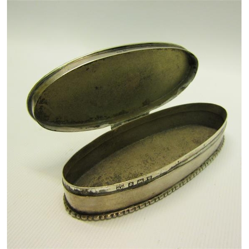 217 - An Edwardian silver toothpick box of oval form with beaded rim, engine turned and enclosed by a hing... 