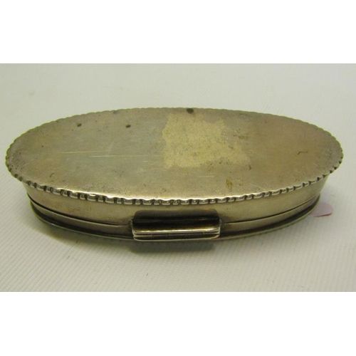 217 - An Edwardian silver toothpick box of oval form with beaded rim, engine turned and enclosed by a hing... 