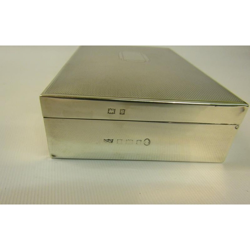 219 - A 20c silver cigarette box of rectangular form, the hinged cover engine turned.  Makers mark for Map... 