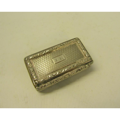 227 - A William IV silver snuff box of rectangular form, the box with ribbed decoration and leaf and flowe... 