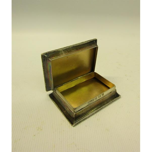 229 - An early 20c Georgian style silver snuff box of rectangular engine turned form with cast leaf and fl... 