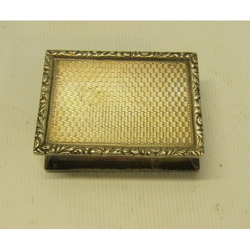 229 - An early 20c Georgian style silver snuff box of rectangular engine turned form with cast leaf and fl... 