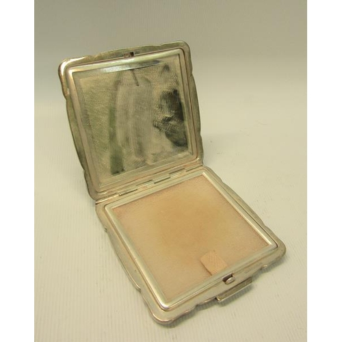 232 - An art deco period German silver compact, engine turned.  925 sterling.  7cms sq.