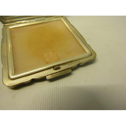 232 - An art deco period German silver compact, engine turned.  925 sterling.  7cms sq.