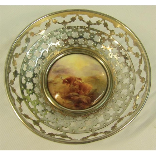 237 - A pair of circular silver bowls, pierced and with James Stinton Royal Worcester bases, both decorate... 