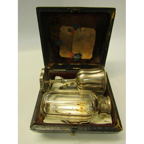 240 - A Victorian travelling communion set with communion cup.  9cms h, a paten on a circular short stand ... 