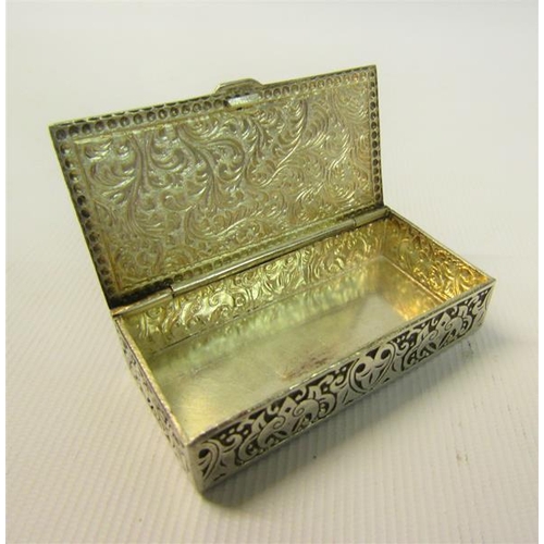 101 - A Continental silver snuff box of rectangular scroll and leaf decorated form with hinged cover.  5.5... 