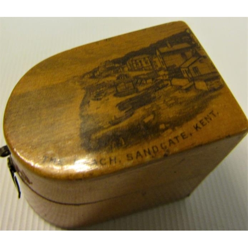 105 - A Mauchline Ware thimble case with a transfer the beach Sandgate, Kent and containing a silver thimb... 