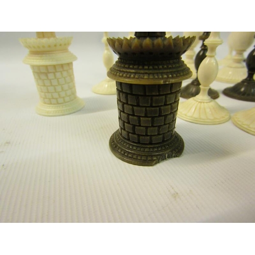 111 - A 19c Indian ivory and horn chess set, the Kings 9cms high - contained in a sandalwood lined box, th... 