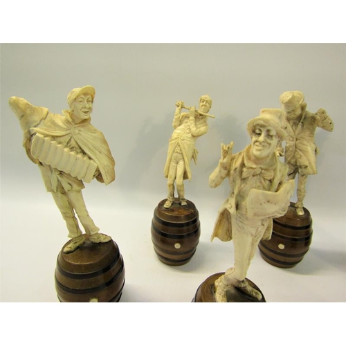 112 - A late 19c German group of six carved ivory street musicians standing on wooden barrels, each figure... 