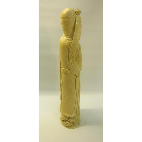 117 - A late 19c Oriental carved figure of a warrior.  36.5cms h.