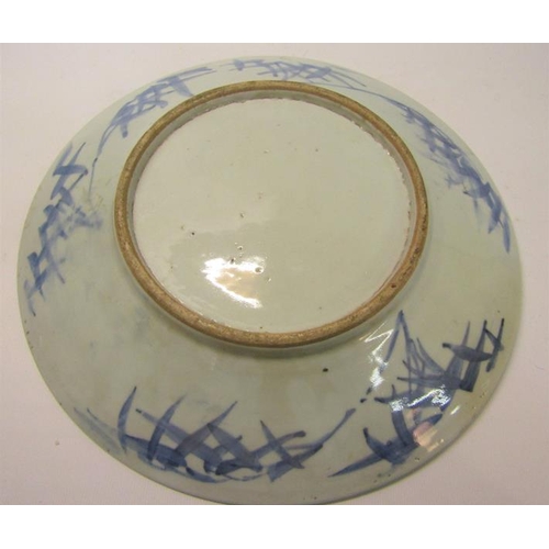 354 - A 19c Chinese blue and white circular dish decorated with Prunus blossom, 29cms dia.