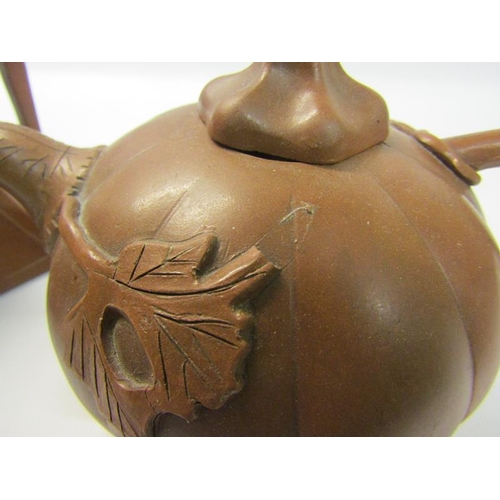 356 - A collection of four 19c Oriental red clay teapots with applied moulded decoration, two with panels ... 