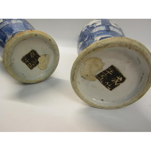 357 - A pair of early 19c Chinese baluster vase and covers, blue on white decorated ladies in veranda sett... 