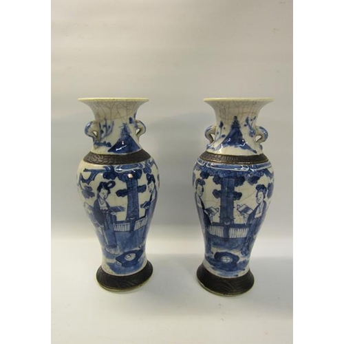 357 - A pair of early 19c Chinese baluster vase and covers, blue on white decorated ladies in veranda sett... 