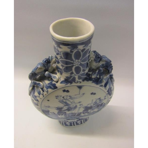 358 - A 19c Chinese moon flask, blue on white decorated with panels of entertainers and moulded serpents t... 