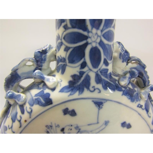 358 - A 19c Chinese moon flask, blue on white decorated with panels of entertainers and moulded serpents t... 