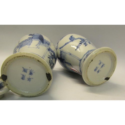 359 - A pair of 19c Oriental crackleware vases of baluster form, decorated blue on white with scholars and... 