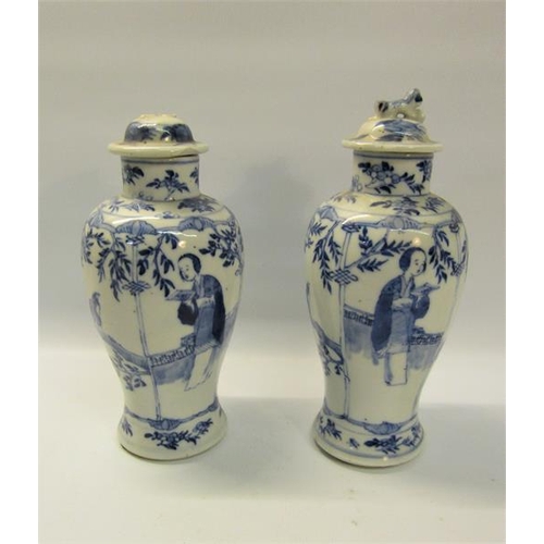 359 - A pair of 19c Oriental crackleware vases of baluster form, decorated blue on white with scholars and... 