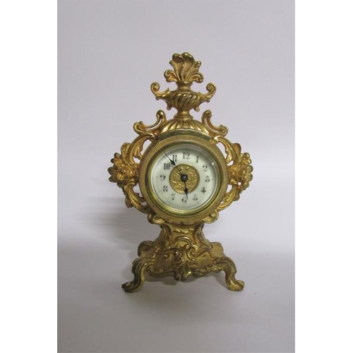 4 - A late 19c American mantel clock by the Amsonia Clock Co. in rococo cast gilt case embellished with ... 