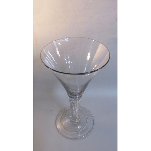 330 - A 19c English toasting glass with a trumpet bowl on an opaque twist tapering stem, with domed folded... 