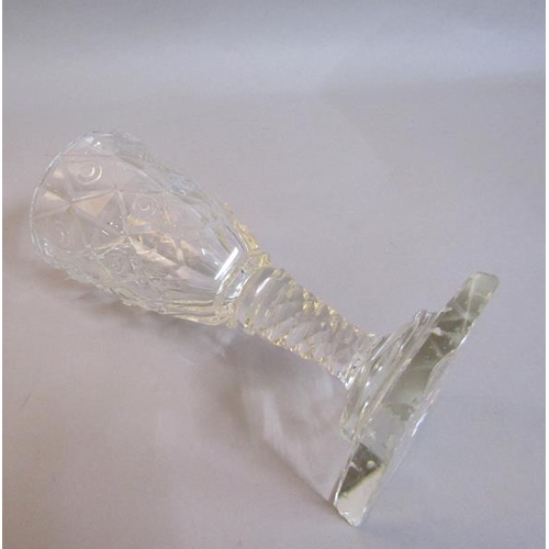 337 - A 19c square base wine glass with a diamond and circle cut bowl on a facet cut stem.  13cm h.