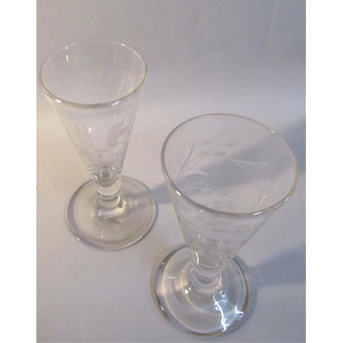 338 - A pair of early 19c English wine glasses with trumpet bowls on lobed reducing columns with dome step... 