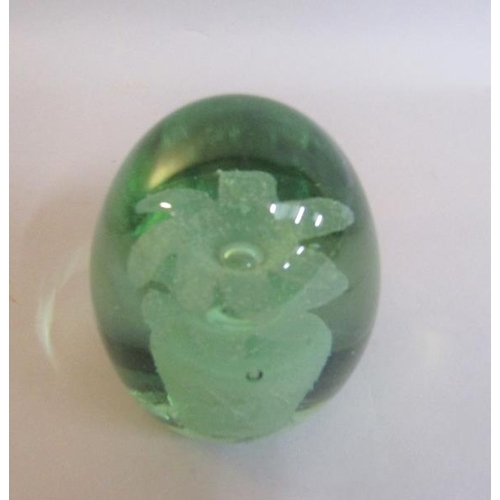 341 - A late 19c green glass dump with flower pot sulphide, having two flowers, 9.5cms h.