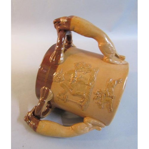 391 - A Doulton Lambeth stoneware hunting tyg with greyhound handles, glazed in brown, impressed marks to ... 