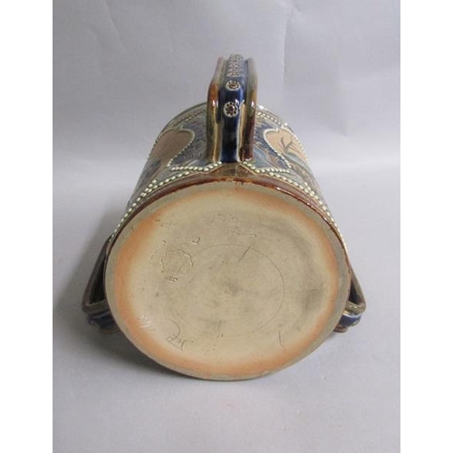 396 - A 19c Doulton Lambeth Florence Barlow three handled tyg with silver rim, with three pate sur pate pa... 