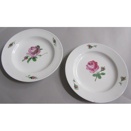 383 - A pair of Meissen soup plates painted with roses.  Cross sword marks in blue to base. 23.5cms dia.