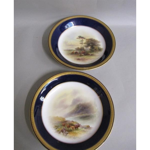 407 - A pair of Royal Worcester circular dishes by John Stinton, one with highland cattle in misty mountai... 