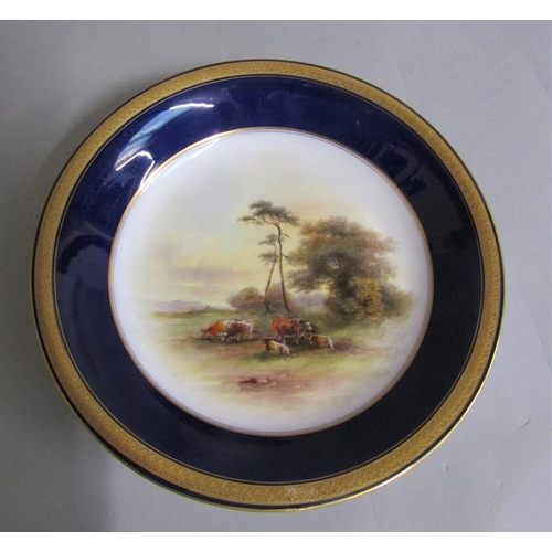 407 - A pair of Royal Worcester circular dishes by John Stinton, one with highland cattle in misty mountai... 