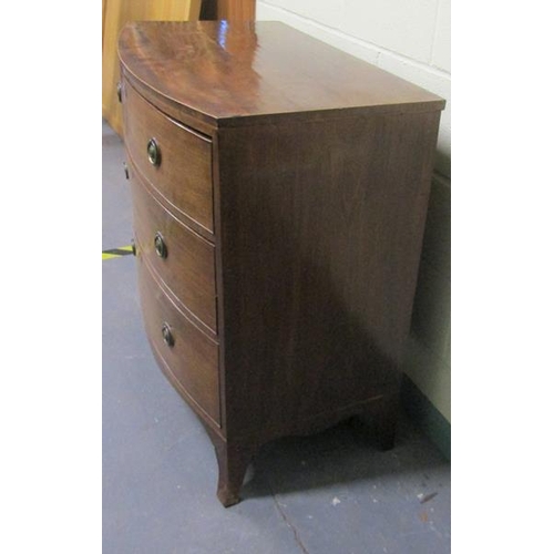 570 - A late Georgian mahogany bow front chest of three long graduated drawers with circular stamped brass... 