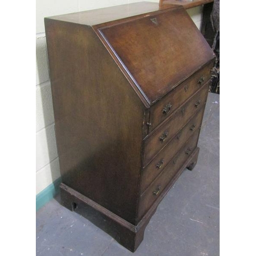 572 - A late Georgian mahogany bureau with fall front and fitted interior over three long drawers and one ... 