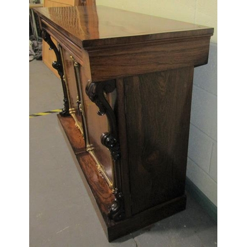 580 - A Victorian rosewood side cabinet of rectangular form, cross banded and with brass rail inlay.  Havi... 