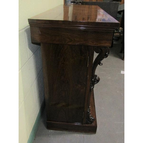 580 - A Victorian rosewood side cabinet of rectangular form, cross banded and with brass rail inlay.  Havi... 