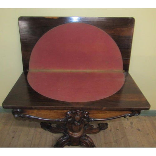 551 - A William IV rosewood fold over card table with scroll moulded frieze supported on a lobed baluster ... 