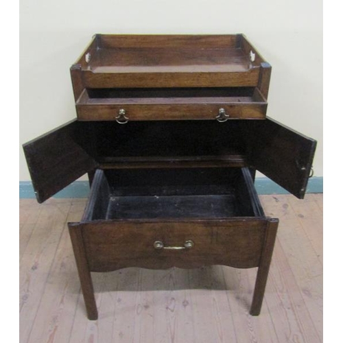 552 - A George III mahogany tray top bedroom commode with pull out drawer over pot cupboard and having one... 