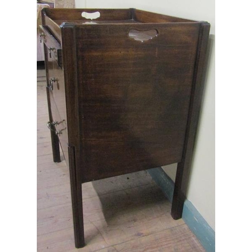 552 - A George III mahogany tray top bedroom commode with pull out drawer over pot cupboard and having one... 