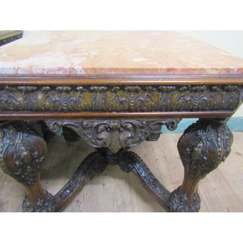 553 - A pair of 19c Continental marble top low tables on carved wood and stucco decorated frames, each wit... 