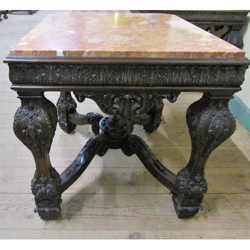 553 - A pair of 19c Continental marble top low tables on carved wood and stucco decorated frames, each wit... 