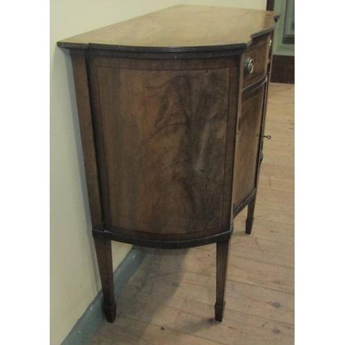 557 - A 19c mahogany side cabinet of serpentine from fitted one long frieze drawer over cupboard base encl... 