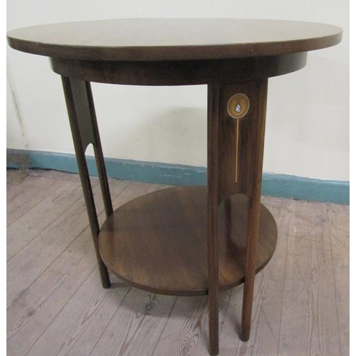 565 - An art nouveau mahogany circular two tier table with circular straight twin column supports having s... 