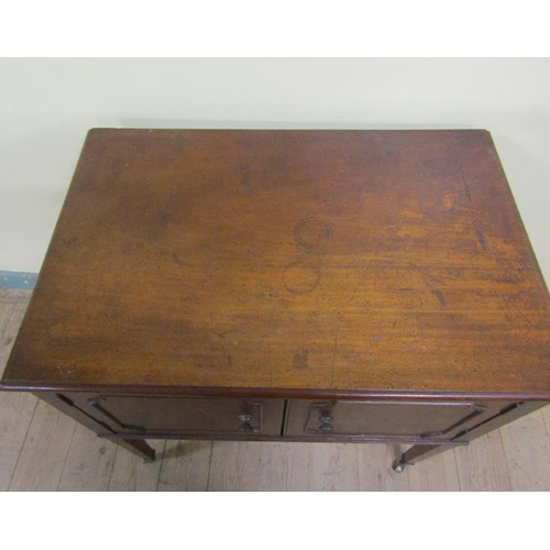 573 - A 19c mahogany bedroom cabinet of rectangular form with moulded top edge, fitted shelf and enclosed ... 